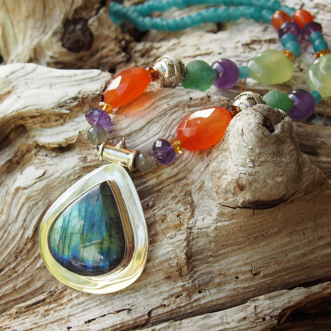 Long beaded necklace with silver and Labradorite pendant, carnelian, amethyst and prehnite stones and silver beads and Indonesian recycled glass beads. Designed and handcrafted by Ula Frou creator Sadie Hodson on Salt Spring Island.